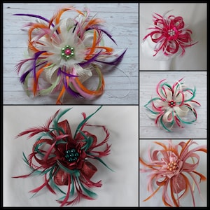 May include: Five different flower hair clips with feathers and beads. The clips are in various colours, including pink, red, green, orange, and white.
