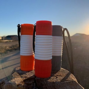 flashlight with glow in the dark paracord wrap