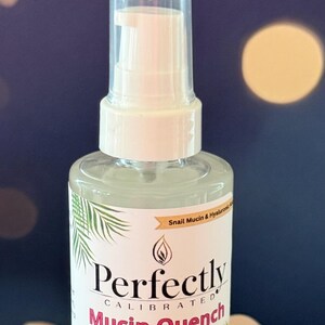May include: A clear glass bottle of Perfectly Calibrated Mucin Quench Serum with a white pump dispenser. The label includes text and palm frond illustrations. The serum is for balancing and calming the skin.