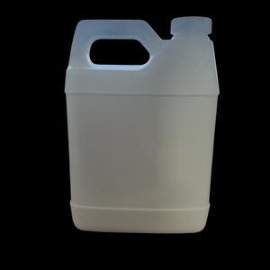 May include: A white plastic jug with a handle and a screw-on cap. The jug is rectangular with rounded corners and a light blue handle. The background is solid black.
