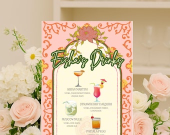 May include: A pink and gold drinks menu with the text "Esha's Drinks" in a decorative font. The menu features illustrations of cocktails, including a Kiran Martini, Strawberry Daiquiri, Moscow Mule, and Patiala Pegg.