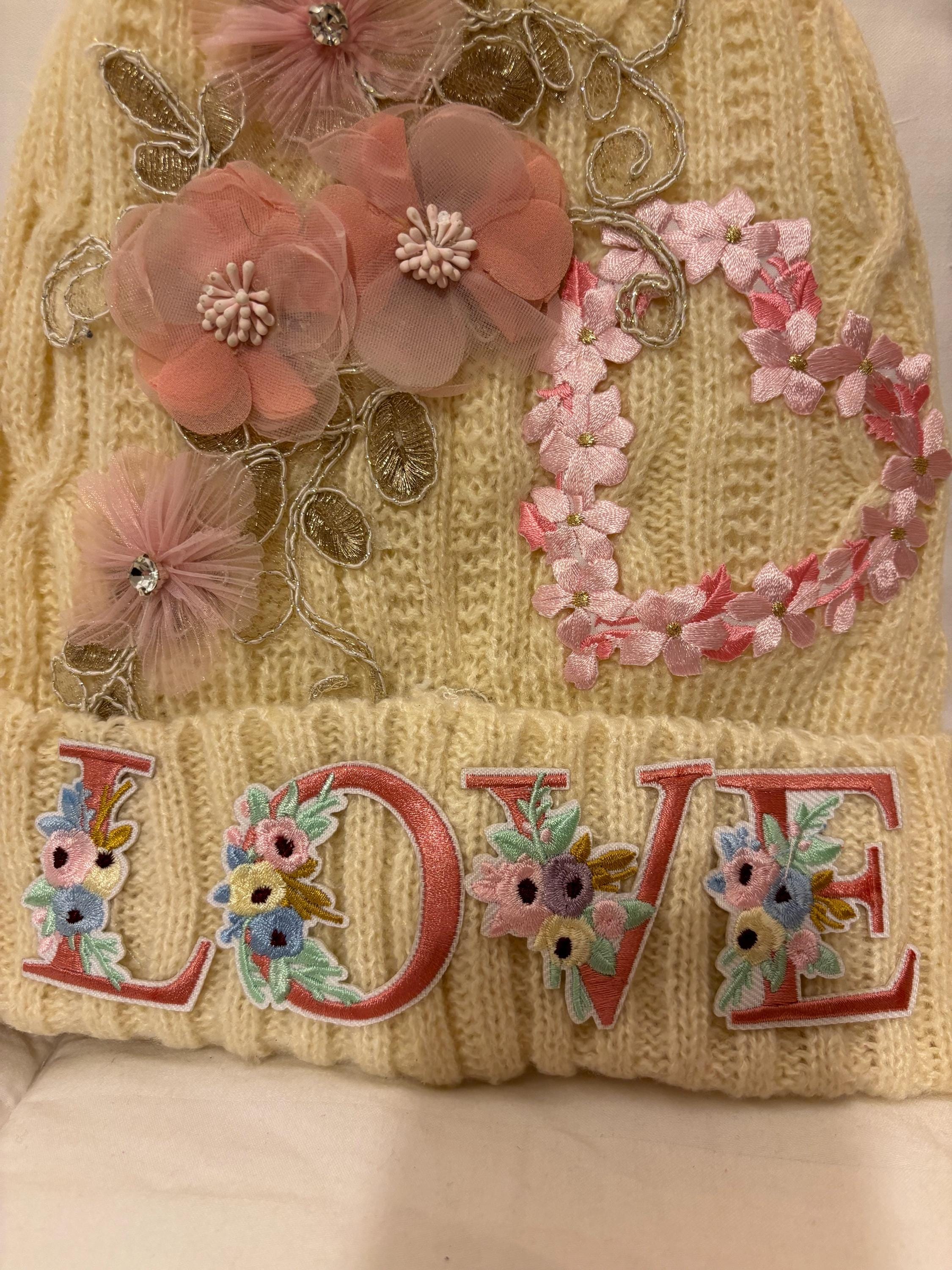 Cream Colored Hat With Cream Colored Lace and Pink Flowers 
