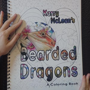 May include: A coloring book titled "Karry McLean's Bearded Dragons: A Coloring Book" with a colorful illustration of a bearded dragon on the cover.