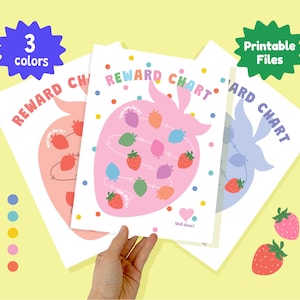 May include: Three colorful reward charts with strawberry designs. Each chart features a large strawberry shape with smaller strawberry illustrations and the words "REWARD CHART". The charts are in pink, peach, and blue, with the text "3 colors" and "Printable Files".