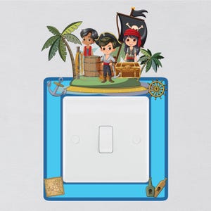 May include: A blue light switch cover with a pirate theme. The cover features a pirate ship, three pirates, a treasure chest, a palm tree, and an anchor. The switch cover is surrounded by a blue border.