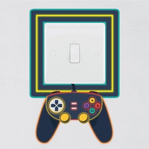 May include: A light switch with a neon green and yellow frame, a black video game controller is plugged into the switch.