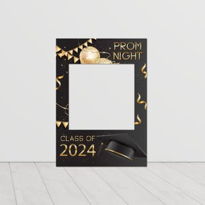 May include: Black and gold photo booth prop with the text "Prom Night" and "Class of 2024". The prop features a graduation cap, confetti, and a disco ball.