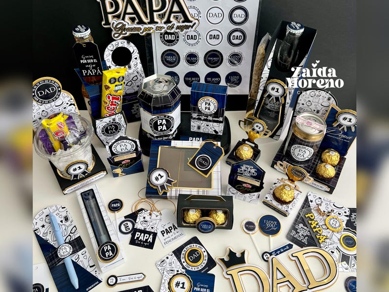 May include: A collection of gift items with a Father's Day theme. The items include decorative boxes, candy, pens, and small bottles, all in a color scheme of black, white, and gold. The word "DAD" is prominently displayed on several items.
