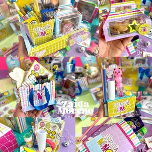 Peut inclure: Plusieurs coffrets cadeaux et contenants color&eacute;s, certains avec le texte "FELIZ DIA NINO" et des visages souriants. Les bo&icirc;tes contiennent divers articles comme des crayons, des autocollants et de petits jouets, avec une vari&eacute;t&eacute; de couleurs et de motifs.
