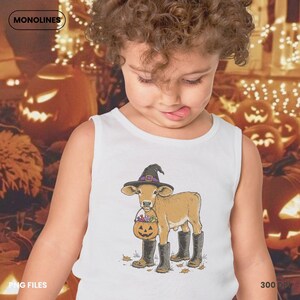 Spooky cow PNG featuring a cute farm calf with Halloween costume, black boots and pumpkin candy bucket in vintage illustration style.
