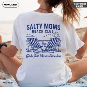 May include: White t-shirt with a blue graphic design that says "Salty Moms Beach Club" with two beach chairs and a sun. The text below the graphic says "Girls Just Wanna Have Sun".