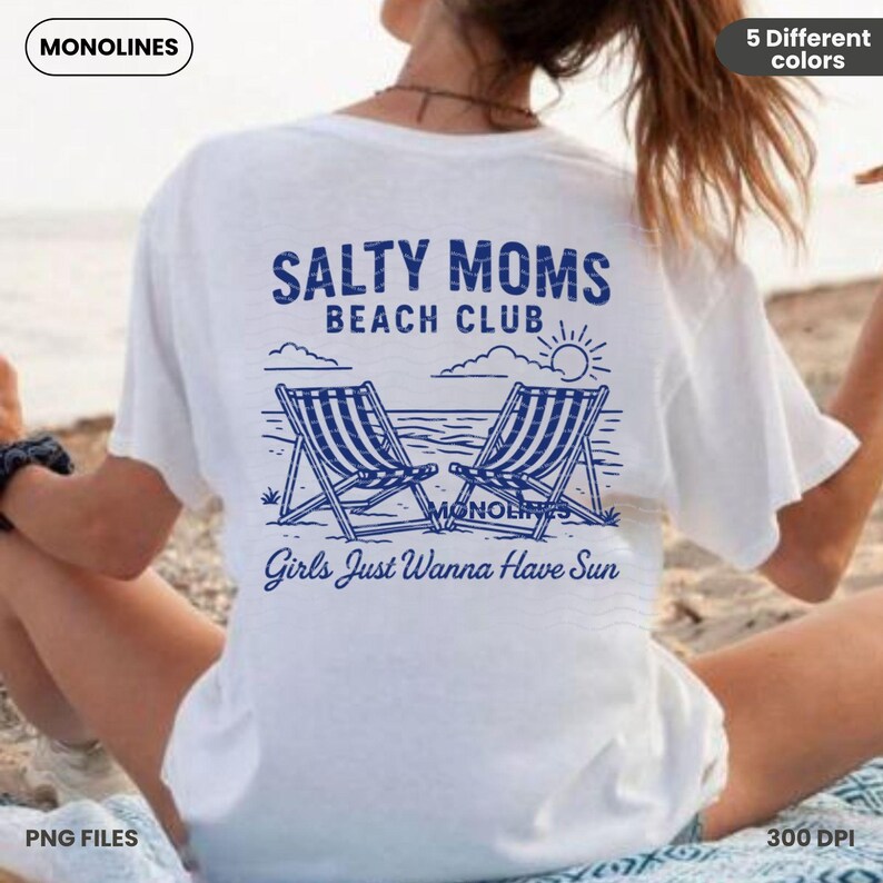 May include: White t-shirt with a blue graphic design that says "Salty Moms Beach Club" with two beach chairs and a sun. The text below the graphic says "Girls Just Wanna Have Sun".