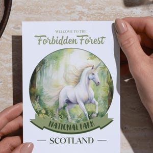 May include: A white unicorn runs through a green forest in a watercolor illustration. The text "Welcome to the Forbidden Forest National Park - Scotland" is printed below the image.