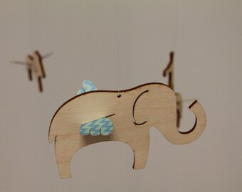 Cute Modern Birch Plywood Mobile to hang over baby crib w/ flying zoo animals, giraffe, lion, & elephant and customizable bright color wings