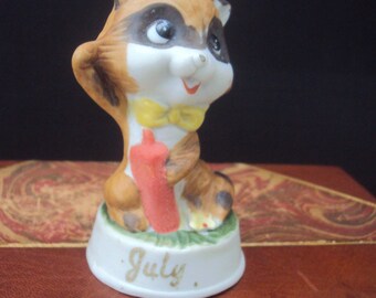 Vintage July Birthday Month 4th of July Firecracker Raccoon Ceramic Figurine