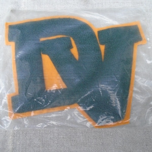 May include: A set of three ceramic mugs with a speckled, matte finish in cream, light grey, and dark grey. Each mug has a simple, minimalist design, ideal for tea or coffee.