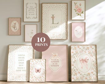May include: A collection of ten framed prints with floral and inspirational designs. The prints feature soft pink and cream colors, with images of a bunny, swan, and butterfly. Text includes "You'll Never Know Dear How Much I Love You" and "You are my sunshine my only sunshine."