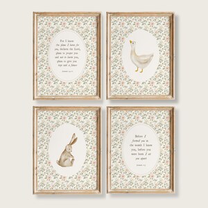 May include: Four framed art prints with watercolour illustrations. Each print has an oval frame with a goose, a rabbit, and text from Jeremiah. The frames are light brown, and the background has a floral pattern.