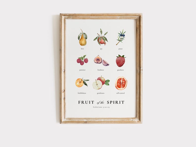 May include: A printable wall art poster with a white background and a wooden frame. The poster features a watercolour illustration of nine fruits, each representing a fruit of the spirit: love, joy, peace, patience, kindness, goodness, faithfulness, gentleness, and self-control. The text "FRUIT of the SPIRIT Galatians 5:22-23" is printed below the fruits.