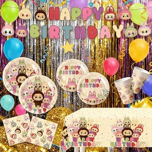 May include: A festive birthday party scene with colorful balloons, a banner reading "HAPPY BIRTHDAY," and matching tableware. The set includes plates, cups, napkins, and a tablecloth featuring cartoon characters. The background has a shiny, gold curtain.