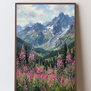 May include: An oil painting in a dark wood frame depicting a mountain landscape with snow-capped peaks, a green valley filled with pine trees, and a foreground of vibrant pink fireweed flowers under a blue sky with soft white clouds.