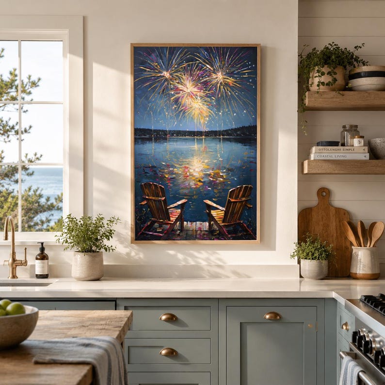 May include: A rectangular wall art print featuring an oil painting of two wooden chairs on a dock overlooking a dark lake at night. Above the water, vibrant yellow, orange, and blue fireworks explode in the sky, reflecting their light onto the lake surface.