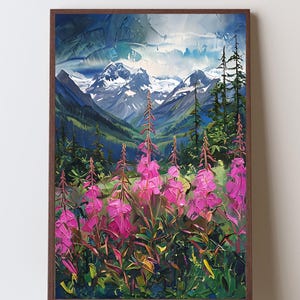 May include: A framed wall art print featuring an oil painting of a mountain landscape. The foreground displays vibrant pink fireweed flowers, while the background shows snow-capped peaks, deep green pine trees, and a cloudy blue sky.