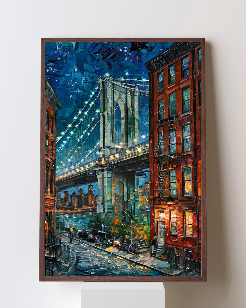 May include: A framed painting depicts the Brooklyn Bridge at night. The artwork uses thick brushstrokes and vibrant colors, with the bridge illuminated by strings of lights. Buildings line the street, and the sky is a deep blue.