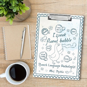 May include: A clipboard with a teal border and a silver clip, featuring a cartoon duck holding a flag that says "fluent bubble." The text "I speak fluent bubble" and "Speech Language Pathologist Mrs. Sophia" are also included.