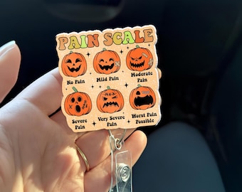 Halloween Pain Scale Badge Reel – Funny Pumpkin ID Holder, Nurse CNA Doctor Medical Badge Clip, Healthcare Humor Gift - Nurses Week Gift