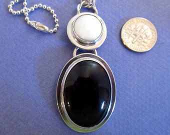 Black onyx and coin pearl bezel set pendant necklace