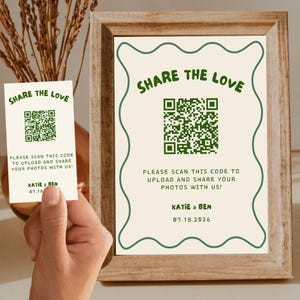 May include: A framed sign and a card with the text "SHARE THE LOVE" in green. The sign and card include a QR code and the text "PLEASE SCAN THIS CODE TO UPLOAD AND SHARE YOUR PHOTOS WITH US!" and the names "KATIE & BEN" and the date "07.18.2026".