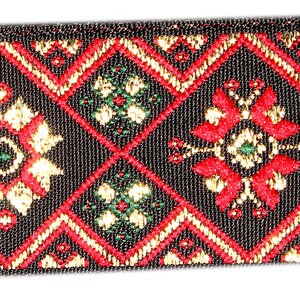 May include: Black ribbon with a repeating pattern of red, gold, and green diamond shapes. The pattern features stylised floral designs.