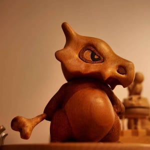 Handcrafted Wooden Cubone Figurine – Minimalist Pokémon-Inspired Decor, Unique Collectible for Home or Office, Nature Gift