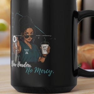 May include: Black ceramic mug featuring a graphic of a female respiratory therapist holding a medical device and a coffee cup. The mug has the text "Blow Harder. No Mercy." and "RT life" on the cup.