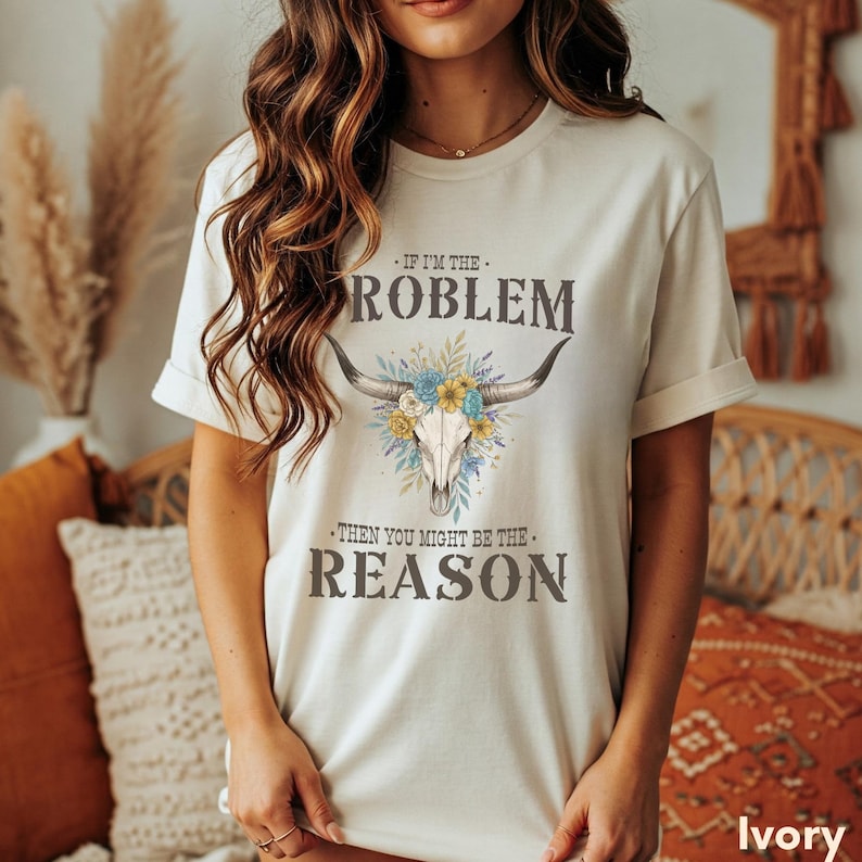 This vintage-inspired Western T-Shirt with Floral Skull offers retro festival vibes with its bold country concert graphic. The Comfort Colors top provides a relaxed fit ideal for summer events, and it makes a thoughtful gift for cowgirls, country music lovers, and edgy western fashion fans alike.