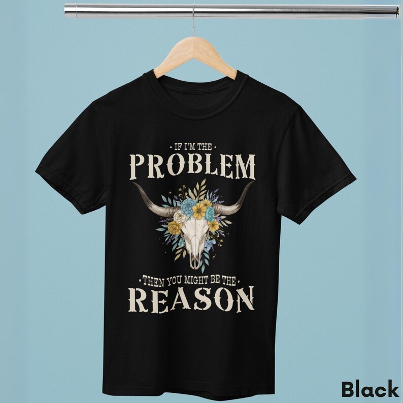A Floral Skull design brings rustic charm to this Western Graphic Tee ideal for rodeos and country concerts. Made with soft Comfort Colors, this retro festival top is great for warm summer days. Vintage graphic tee lovers and country music fans will love this unique cowgirl shirt as a casual gift idea.