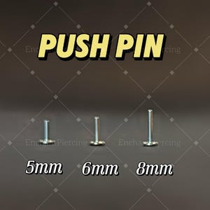 May include: Image of three silver push pins with flat backs, labeled with sizes 5mm, 6mm, and 8mm. The text "PUSH PIN" is displayed in a yellow and black font above the pins. The background is a dark gray color.