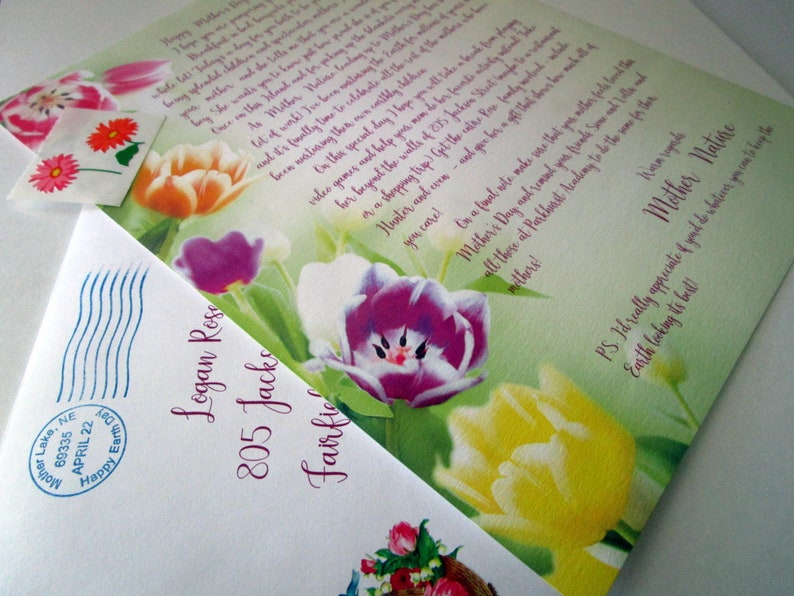 May include: A green and white card with a floral design featuring tulips in shades of pink, purple, yellow, and orange. The card has a handwritten message that reads "Happy Mother's Day!" and "Mother Nature".