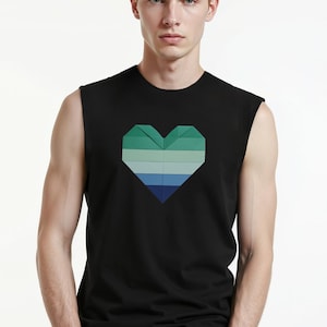 May include: Black sleeveless top with a geometric heart design in shades of green and blue. The heart is centered on the front. The top is made of a soft material.