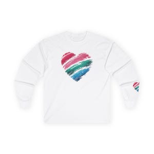 May include: White long-sleeve t-shirt with a colorful, brushstroke heart design on the front.
