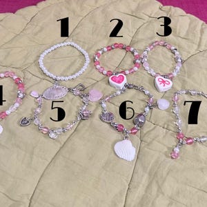 One of a kind Handmade nonwater proof coquette, seashell, bow, charm braclets!