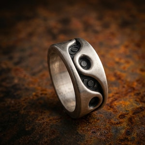 May include: A white ceramic mug with a black handle and the text "But First, Coffee" in a handwritten style. The mug is on a white surface. The mug is approximately 4 inches tall.