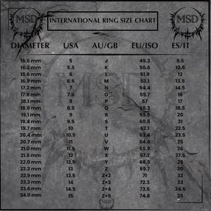 May include: A grayscale ring size chart with the text "INTERNATIONAL RING SIZE CHART" and measurements in millimeters, USA, AU/GB, EU/ISO, and ES/IT. The chart includes ring diameters from 15.6 mm to 24.0 mm, with corresponding sizes.