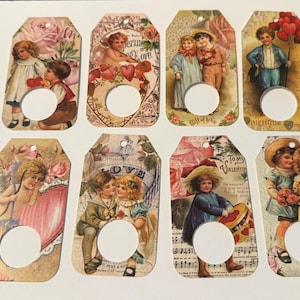 May include: Eight vintage-style Valentine's Day gift tags. Each tag features illustrations of cherubs, children, and hearts, with a distressed, aged appearance. The tags have a hole for attaching to gifts and are decorated with floral and romantic elements.