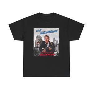 May include: Black t-shirt with a graphic of a man holding a gun and the text "The Alexandrians You got them on the run Quickman".