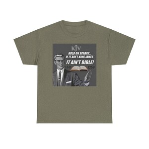 May include: A green t-shirt with a graphic of a man in a suit holding a book. The graphic says "KJV HOLD ON SPARKY... IF IT AIN'T KING JAMES IT AIN'T BIBLE! 1611 1769"