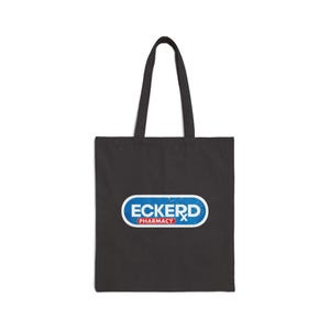 Puede incluir: Bolsa de tela negra con un logotipo azul y blanco que dice "Eckerd Pharmacy".