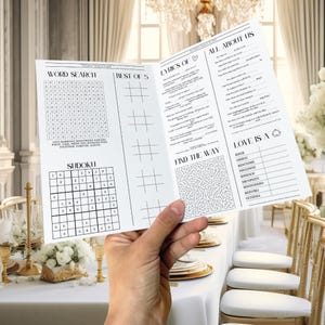 Puede incluir: Un folleto de actividades de boda en blanco y negro con búsqueda de palabras, Sudoku y otros juegos. El folleto incluye el texto "Lyrics of" y "All About Us". El folleto se sostiene sobre una mesa.