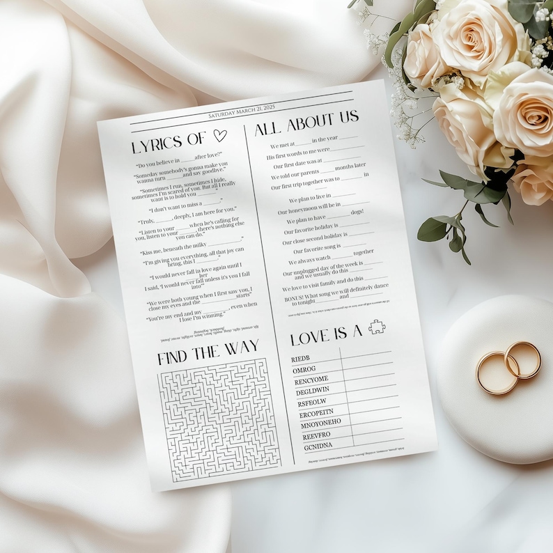 May include: A white paper wedding activity sheet with black text featuring sections titled Lyrics Of, All About Us, Find The Way, and Love Is A. The sheet includes fill-in-the-blank lines, a maze, and a word scramble game for guests to complete.